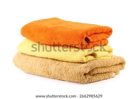 Stack of soft towels isolated on white
