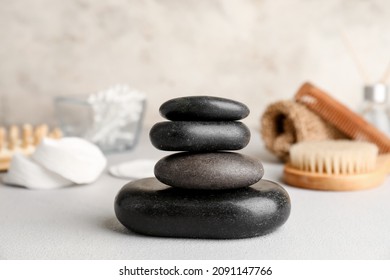 Stack of spa stones on light background