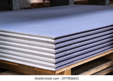 The stack of Special gypsum board with enhanced sound Acoustic insulation Plasterboard. Panel Type DF for indoor concrete walls prepared for construction