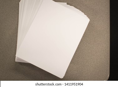 Stack of spread out white paper