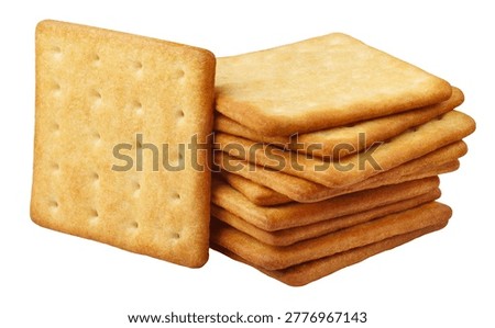 Stack of square crackers with one standing biscuit, isolated on white background