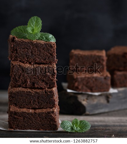 Similar – quadratische Stücke Schokoladenbrownie