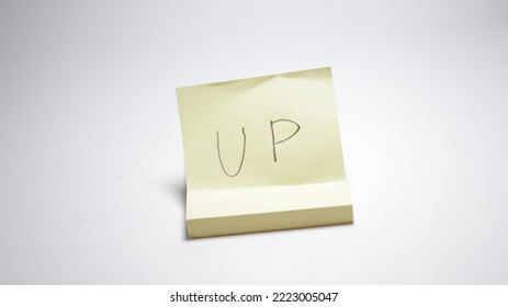 Stack of stick note isolated on white with clipping path. Word Start. Word UP. Sticky note stickers isolated on white background.