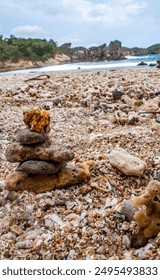 stack of stone on beach 