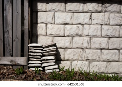 stack stone tiles to the wall