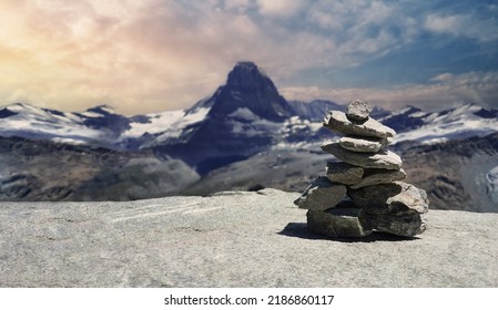 Stack of stones on top of the mountain. Pile of rocks stone and mountains. Balanced stone pyramid or Stacked stone or mountain stones tower. Stones arranged for meditation. Represent spirit of Zen. - Powered by Shutterstock