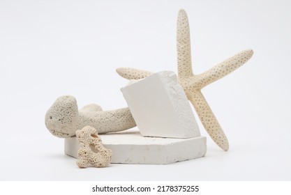 Stack stones platform podium and starfish on gray light copy spase background. Minimal empty display product presentation scene.