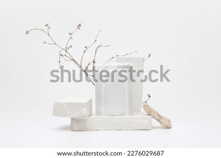 Stack stones platform podium and twig on gray light copy spase background. Minimal empty display product presentation scene.