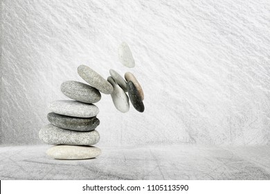 stack of stones while falling apart, abstract concept