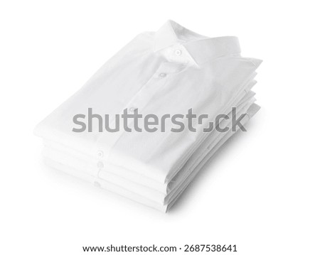 Stack of stylish folded collar shirts isolated on white background