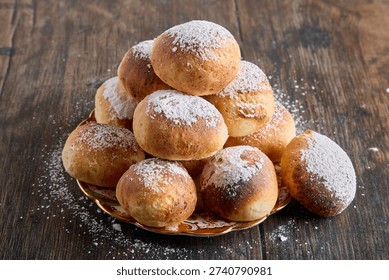 Stack of Sweet Buns Dusted with Powdered Sugar