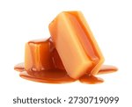 Stack of sweet caramel candy cubes topped with caramel sauce isolated on a white background. Two pieces of caramel.