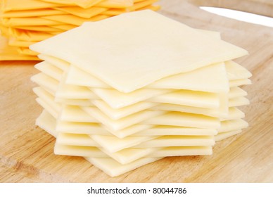 A Stack Of Swiss Cheese Slices