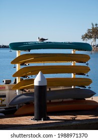 Stack Of Tandem Kayaks Waiting For Active People To Rent Them.