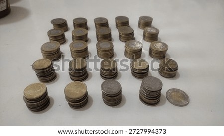 stack of ten rupees coins