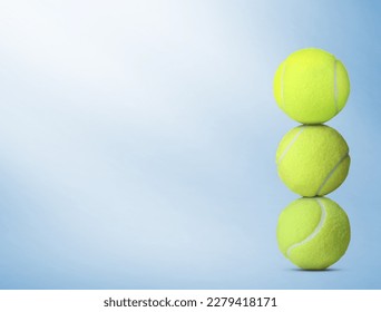 Stack of tennis balls on light blue background. Space for text - Powered by Shutterstock