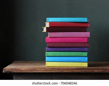 stack of textbooks in the colored cover on the table. Back to school. September 1, knowledge day.