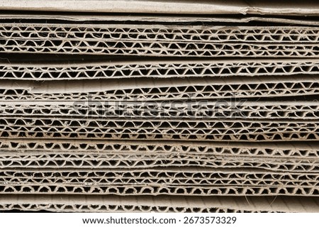 A stack of thick corrugated cardboard sheets close-up. Background.