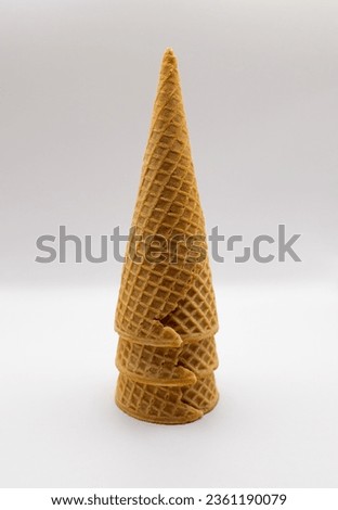 Stack of three cones on a white background