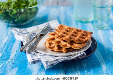 A Stack of Three Plain Waffles on a Plate