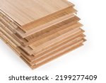 Stack of the three-layer engineered wood flooring boards with white oak face layer, pine core layer and glue-less locking joint system, fragment of butt-end parts close-up 
