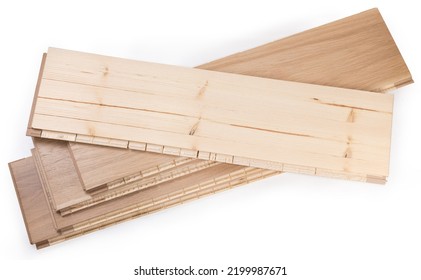 Stack of the three-layer engineered wood flooring boards with white oak face layer, pine core layer and glue-less locking joint system, top board turned face down on a white background