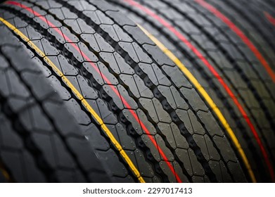 Stack of tires with markings red and yellow lines