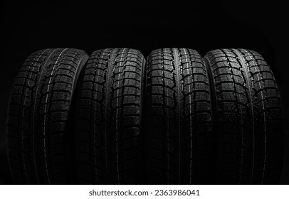 Stack of tires on black background