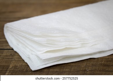 Stack Of Tissue Papers On Wood.