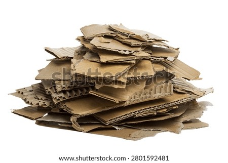 Stack of torn corrugated cardboard pieces with rough edges, isolated 