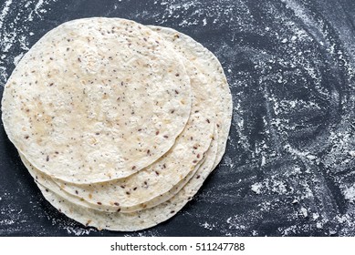 Stack Of Tortillas On A Black Surface