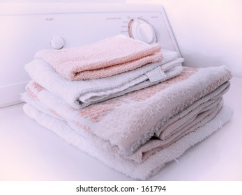 Stack Of Towels On The Dryer.