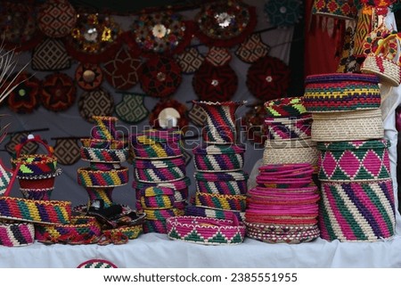  Stack of traditional Plates and handmade ceramics, handmade colorful dishes , Handicraft kettle item, Colorful Handmade Pottery and Ceramics, Souvenir Shop in lok virsa mela Islam