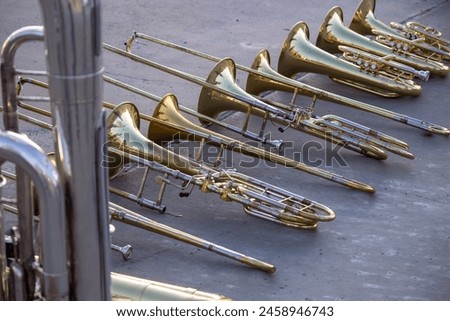 Stack of Trombones, Baritones, Mellophone, and Tuba
