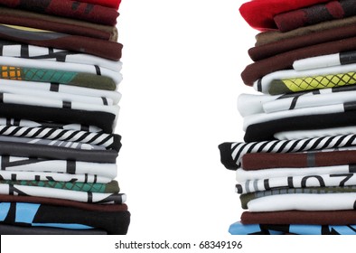 stack of t-shirt and clothes, over white background