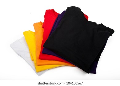 A Stack Of T-shirts Isolated On White Background