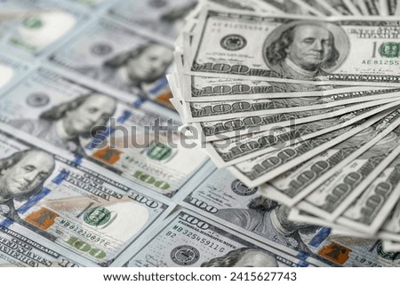 Stack of Twenty Dollar Bills in a Pile on Top of Each Other. A neat stack of twenty dollar bills sitting on top of each other.