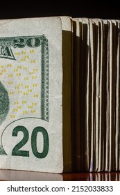 stack of twenty dollars banknotes on table, close up
