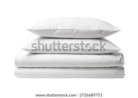 Stack of two white pillows and two folded bed linens on white background