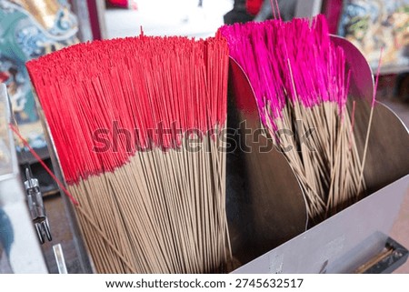 Stack of unlit incense sticks inside temple