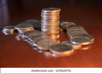 Stack of US Coins and Fallen Stacks of Coins