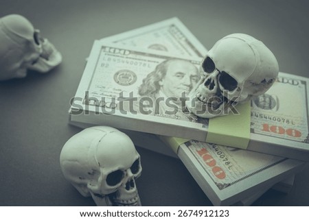 Stack US dollar banknotes with skulls. Dedollarisation concept. Countries dumping the US dollar, reduce their reliance on the US dollar as medium of exchange, a reserve currency and unit of account.