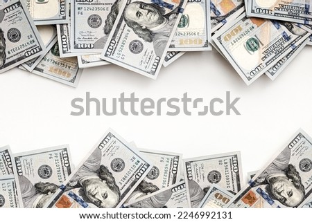 Stack of US paper currency. Dollars closeup concept. American Dollars cash money. One hundred dollar banknotes. Top view. Space for text. Negative space. Banknotes top and bottom