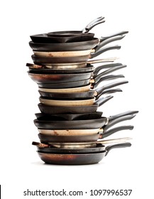 Stack  of used frying pans isolated on white 