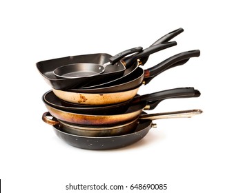 Stack  of used frying pans isolated on white 