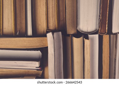 Stack Of Used Old Books In The School Library, Toned Cross Processed Image.