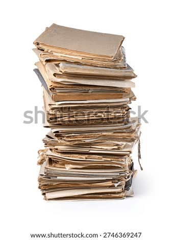 Stack of various aged files and brown papers representing history