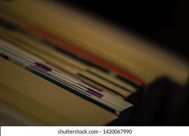 A stack of various books. 