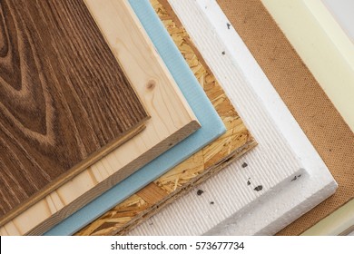 Stack Of Various Construction Supplies. Insulation Foams And Wood Boards.