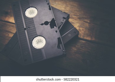 Stack Of Video Tape Cassette Over Wooden Background